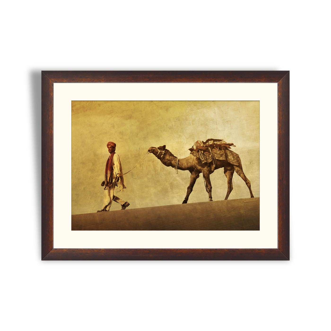 Man walking through the desert with his camel