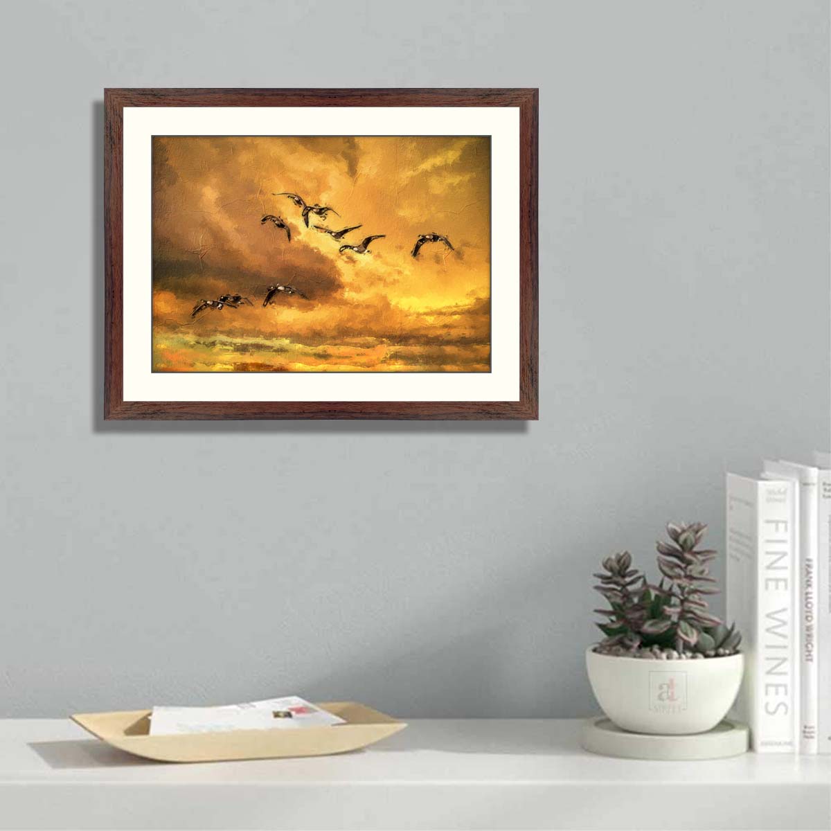 Canada geese in flight in red skies